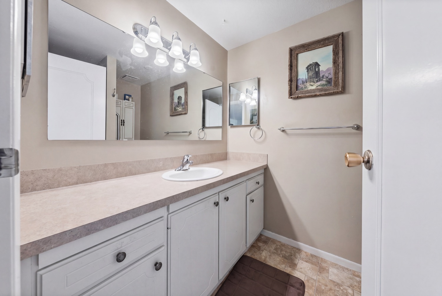 Full bathroom with vanity and tile floor
