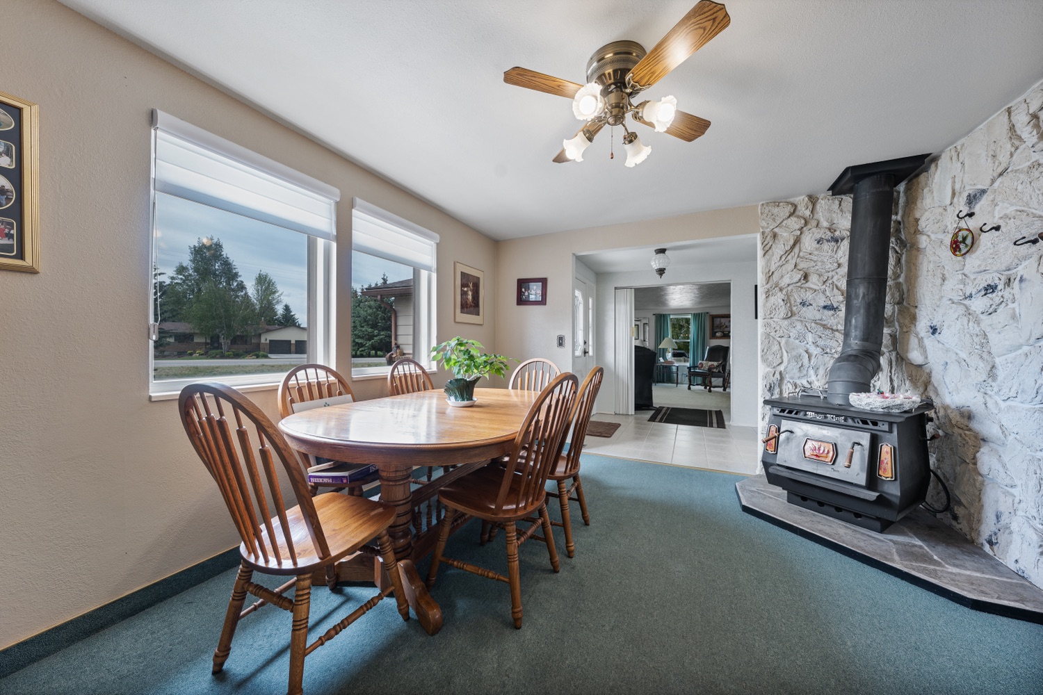 Dining room with wood-burning stove in a stone hearth