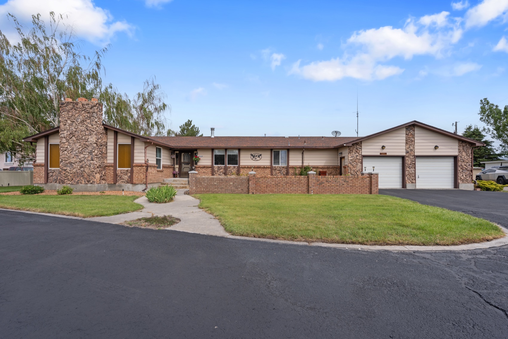 2224 E Highway 33 — single-level brick ranch on 0.88 acres in Sugar City, Idaho